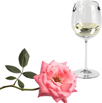 Ein Weißweinglas und eine rosa Rose